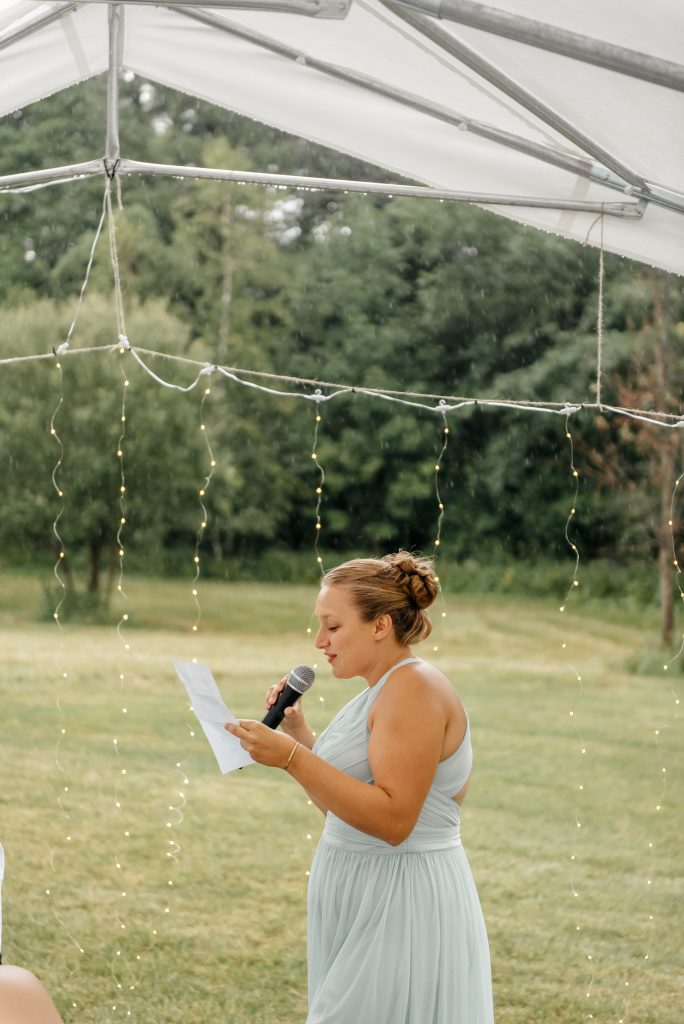 A bridesmaid explains that this beautiful wedding for her friends under a tent with fairy lights is one of the best places to get married in upstate new york